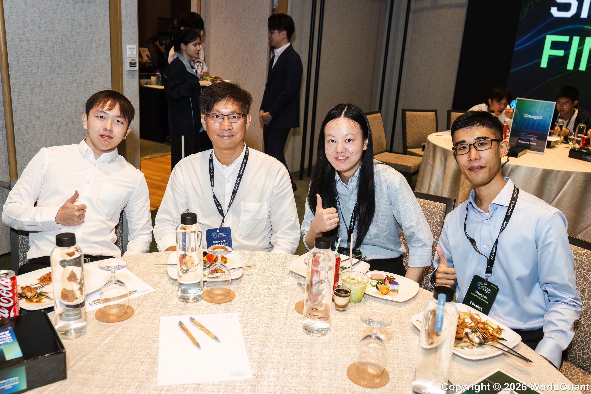 (from left): Sean Jean Moey (competitor representing NUS), Professor Kwong Koon Shing, Lucius Li, Mark Bosco from SMU at the 2026 IQC.