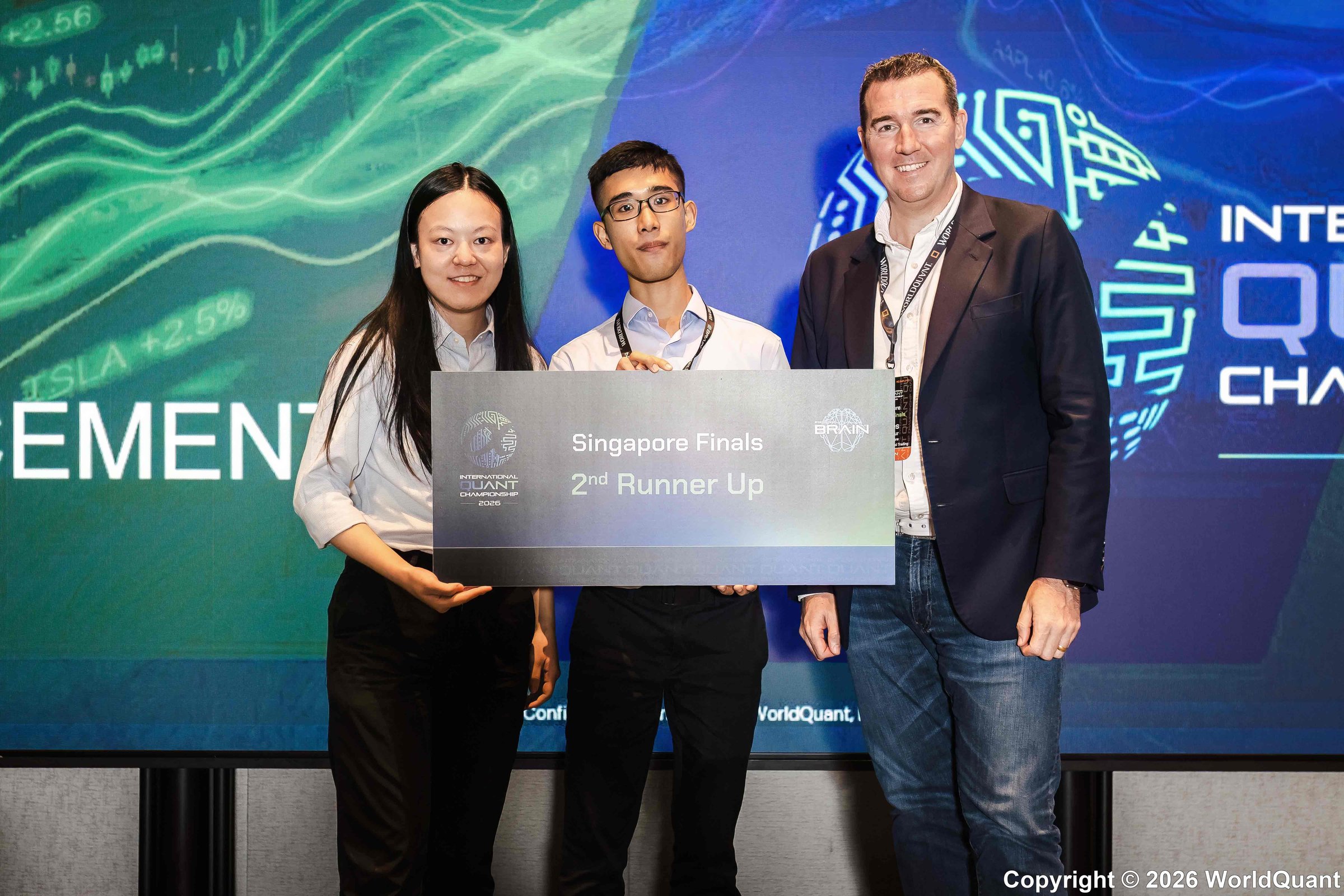 (from left): Lucius Li, Mark Bosco, James Macarthur (CEO of WorldQuant Singapore) from SMU at the 2026 IQC.