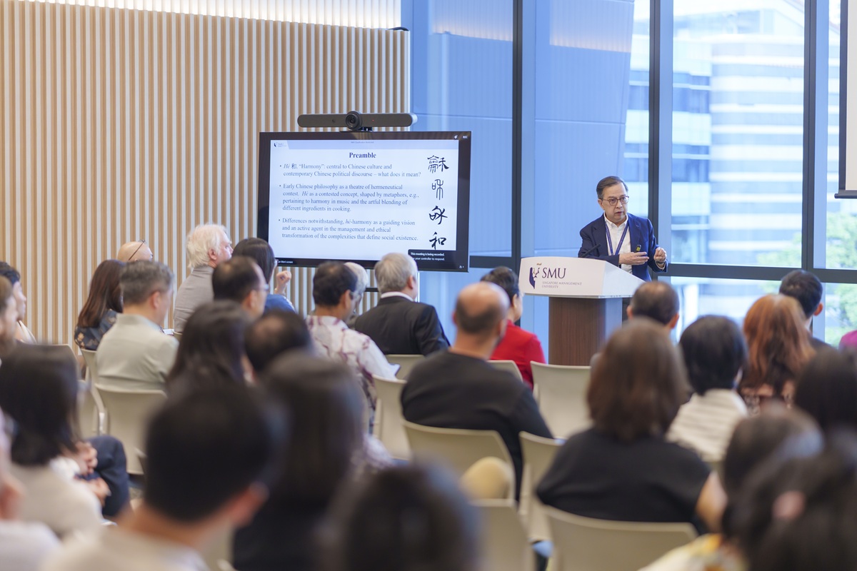 SMU Provost Prof Alan Chan delivering his inaugural Chair Professorship lecture on Chinese philosophical concepts of harmony to an engaged audience.