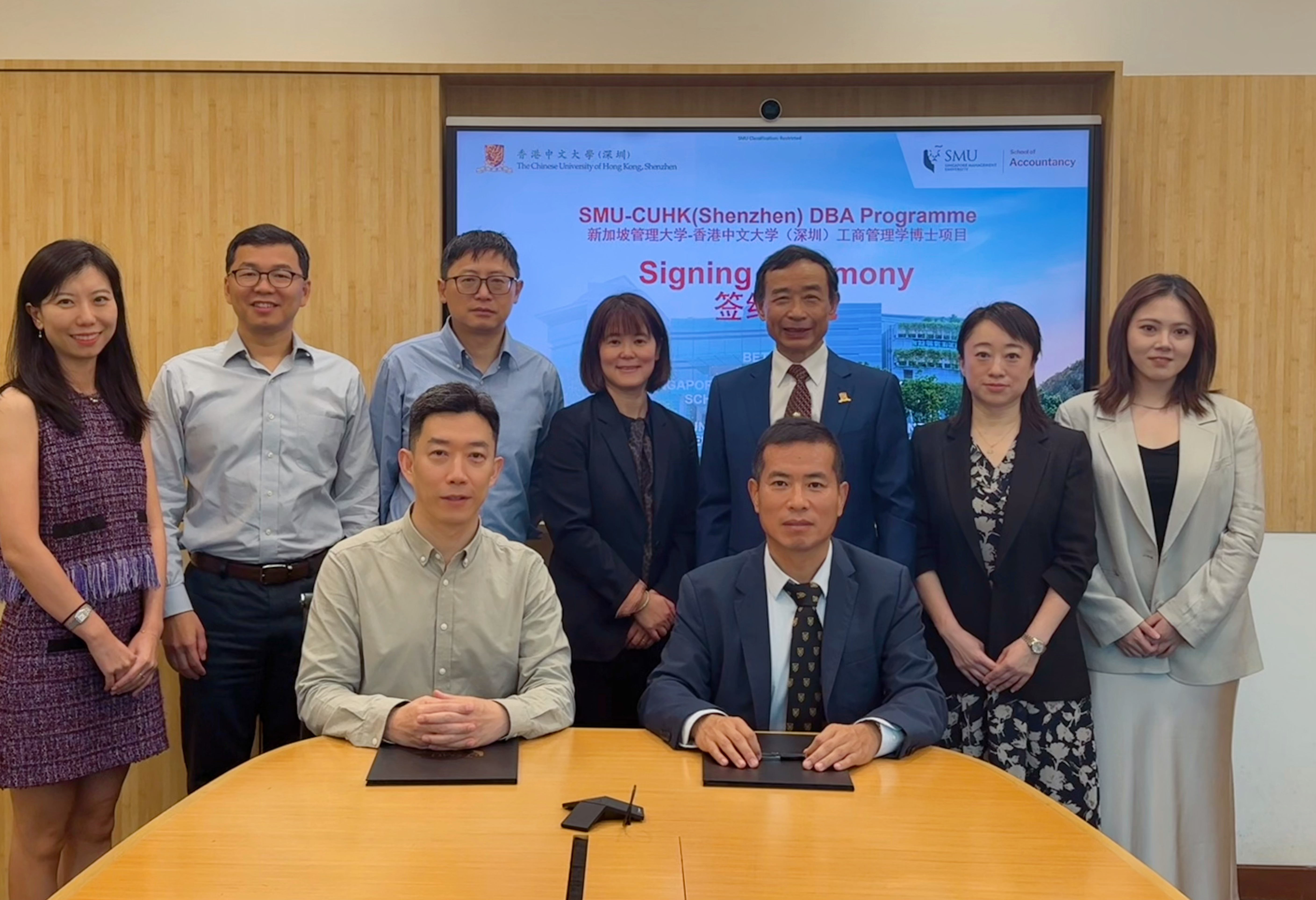 Representatives of both universities at the signing ceremony