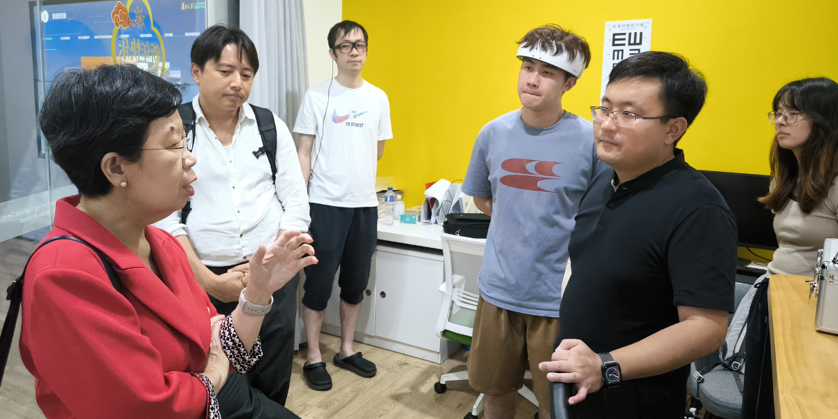 Professor Lily Kong and Associate Professor Kim Seonghoon with researchers at the FIA Laboratory of Aging Psychology and Behavioural Science.