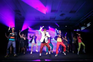 Professor Arnoud De Meyer leading SMU staff and faculty members in Gangnam Style dance number.