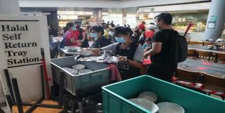 Patrons returning their used crockery at the NTUC Foodfare outlet in AMK Hub in January 2022. ST FILE PHOTO