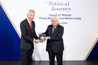 Dr Tony Tan presenting a copy of his book to PM Lee Hsien Loong at the book launch.