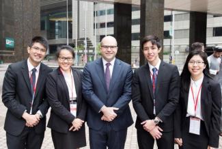 Jason Lim (far left), Eden Li (2nd from left), Jerald Soon (2nd from right), Nicolette Oon (far right), with one of the judges of the Vis (East) moot competition