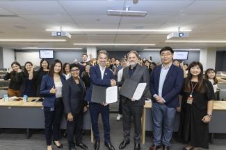 The MOU exchange ceremony between SGFC and NAM Singapore: (L-R): Catherine Chong, Director, SMU Office of Industry Engagement; Ana Dhoraisingam, CEO of NAM Singapore; Eric Pedersen, Head of Responsible Investments at NAM; Professor Bert De Reyck, Dean of LKCSB; Associate Professor Hao Liang, Co-Director of SGFC; and Yvonne Chan, Chief Financial Officer and Vice President, Finance, SMU Office of Finance.