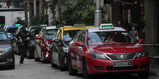 The study also showed that satisfaction over service dipped owing to difficulties in getting rides and a lack of discounts. TNP PHOTO: KELVIN CHNG
