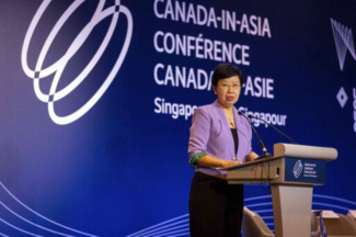 SMU President Professor Lily Kong addressing the audience at the opening plenary session.