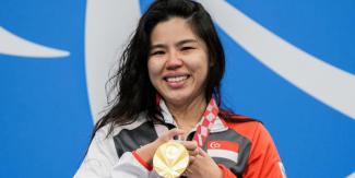 An emotional Yip Pin Xiu with her Tokyo Paralympic gold medal. PHOTO: SPORT SINGAPORE