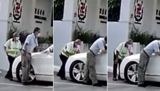 Screengrabs of a video circulating on social media showing a car moving forward, pushing back a security officer at the entrance of Red Swastika School in Bedok.
