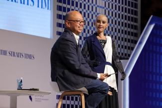ST's associate editor for newsroom strategy Jeremy Au Yong with Sophia, the world’s first humanoid robot, at the ST Education Forum 2024. ST PHOTO: ONG WEE JIN