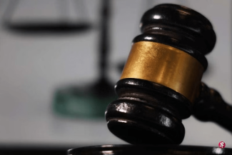 The serious consequences of a criminal conviction require that the court must be convinced that the defendant is guilty beyond reasonable doubt before convicting him; before that, the defendant enjoys the presumption of innocence. (Photo by Wang Yanyan)