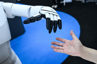 There is growing evidence that AI boosts productivity, particularly in white-collar roles where humans work alongside machines. PHOTO: AFP