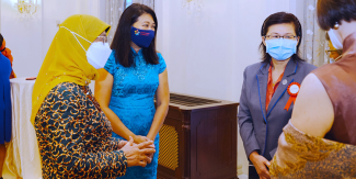 (From left) President Halimah Yacob with Singapore Council of Women's Organisations president Jamie Foo and Professor Leo Yee Sin, and the Istana on March 8, 2022. PHOTO: SINGAPORE COUNCIL OF WOMEN'S ORGANISATIONS