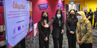 (From left) Ms Ng Yan Qing, Ms Jennifer Poernomo, and Ms Michelle Leong, introducing their peer-learning platform Edugether to President Halimah Yacob, on Jan 12, 2022. ST PHOTO: KEVIN LIM