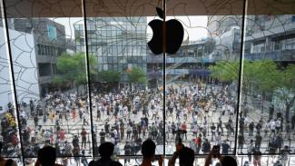People queue up to enter a new Apple flagship store that opened in Beijing in July. (PHOTO: AFP/WANG Zhao)