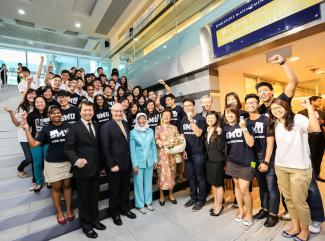Smiles all around as a beaming Mrs Wong Kwok Leong (front row, 4th from left), Guest-of-Honour Mdm Halimah Yacob (front row, 3rd from left); SMU President Professor Arnoud De Meyer (front row, 2nd from left) and Director of the Mrs Wong Kwok Leong Student Wellness Centre, Mr Timothy Hsi (front row, 1st from left), posed for a photo with SMU peer helpers.