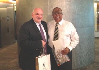 All smiles as Mr Etienne Desmet, Chief Operating Officer of Université Paris-Dauphine (left), posed for a picture with SMU Deputy President and Provost, Prof Rajendra Srivastava (right) after the successful visit by the French delegation to SMU.