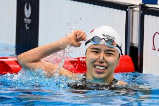 Singapore's Yip Pin Xiu celebrates after winning the women's 50m backstroke S2 at the Tokyo Aquatics Centre. PHOTO: AFP